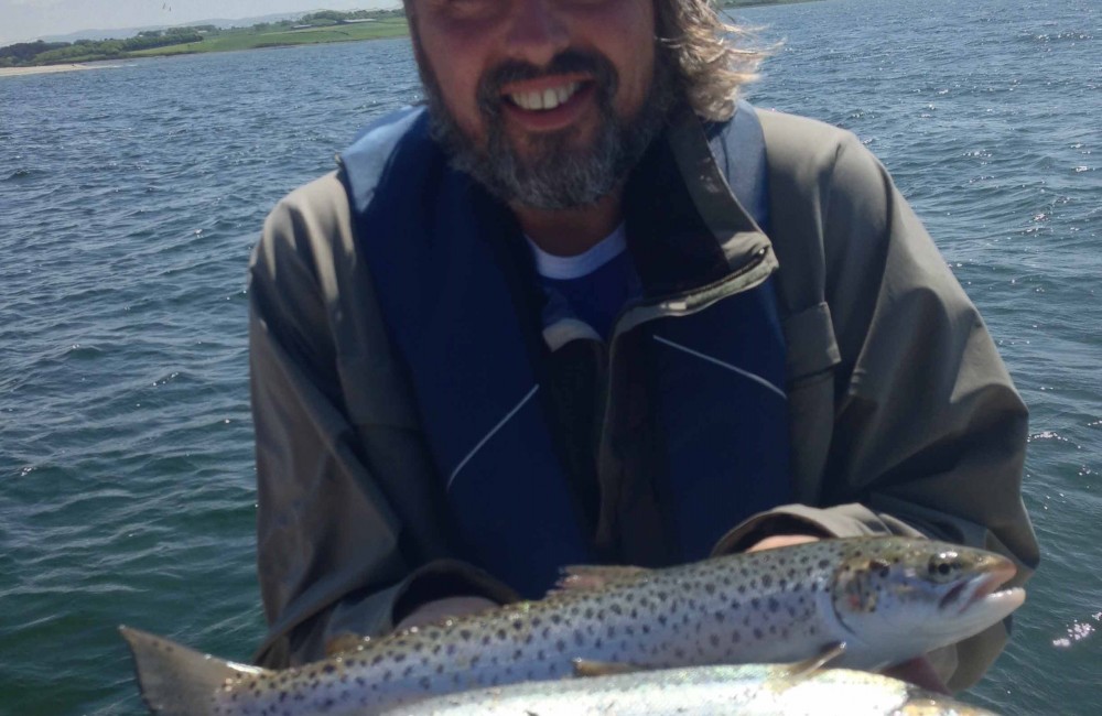 Martin van Seemus shows two fresh run Moy Estuary sea trout on Pegasus